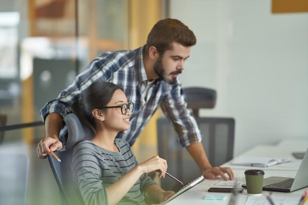 a mentor coaching a young developer on angular